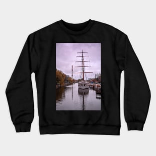 Sailboat at sundown in Klaipeda Crewneck Sweatshirt